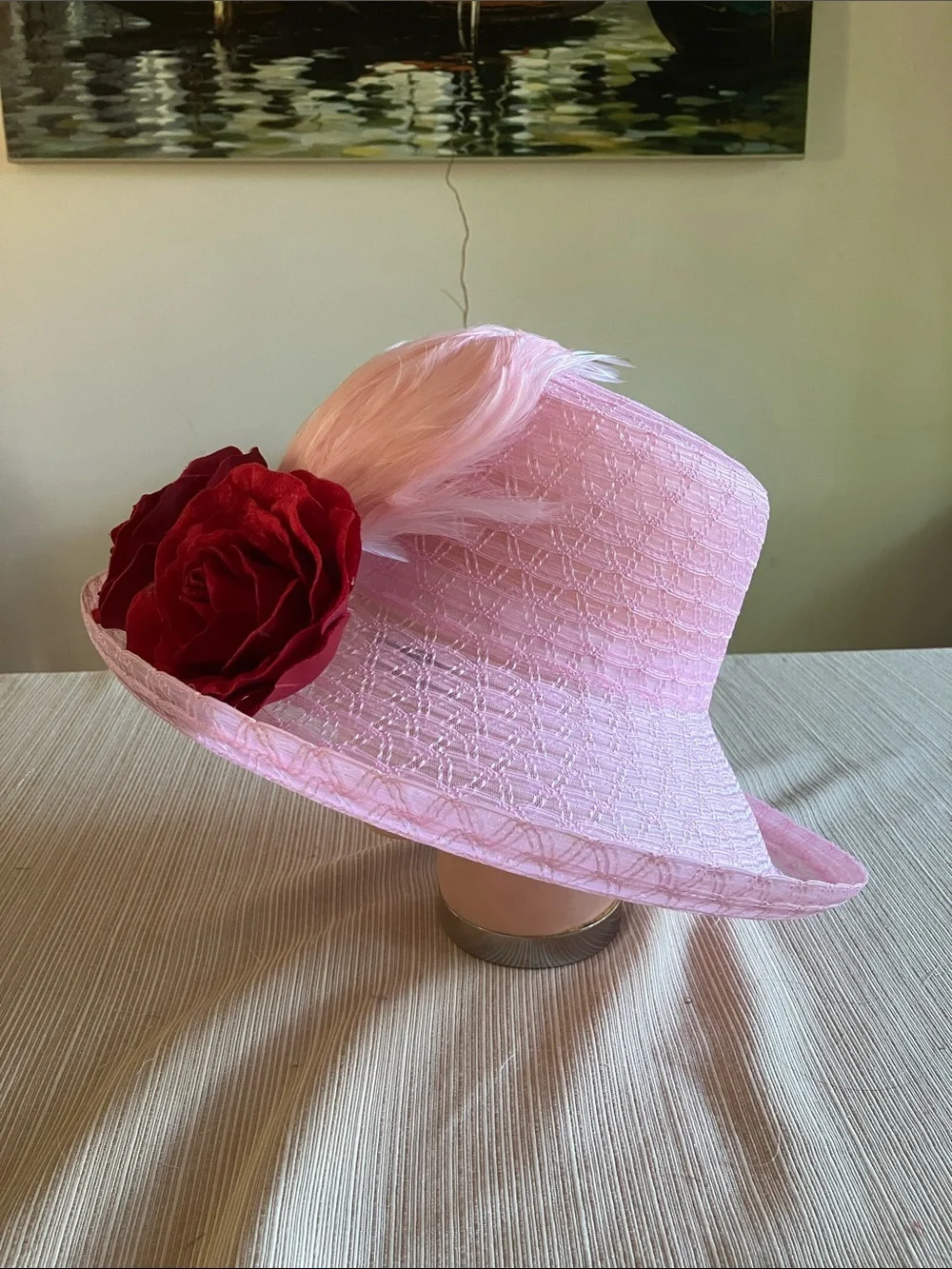 Chic Pink Wide-Brim Hat with Red Velvet Rose Detail and Feathered Accents